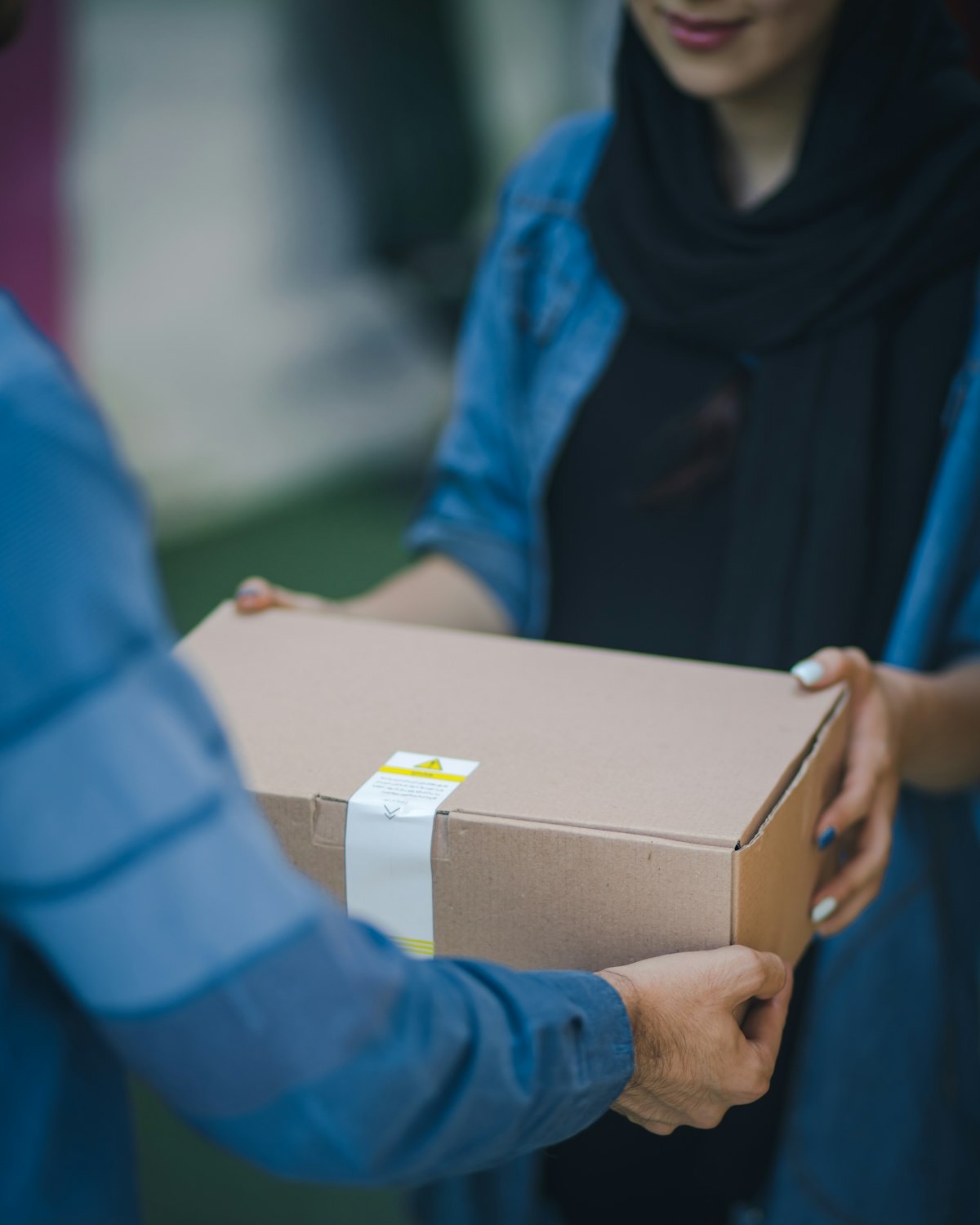 A parcel being handed over at the door